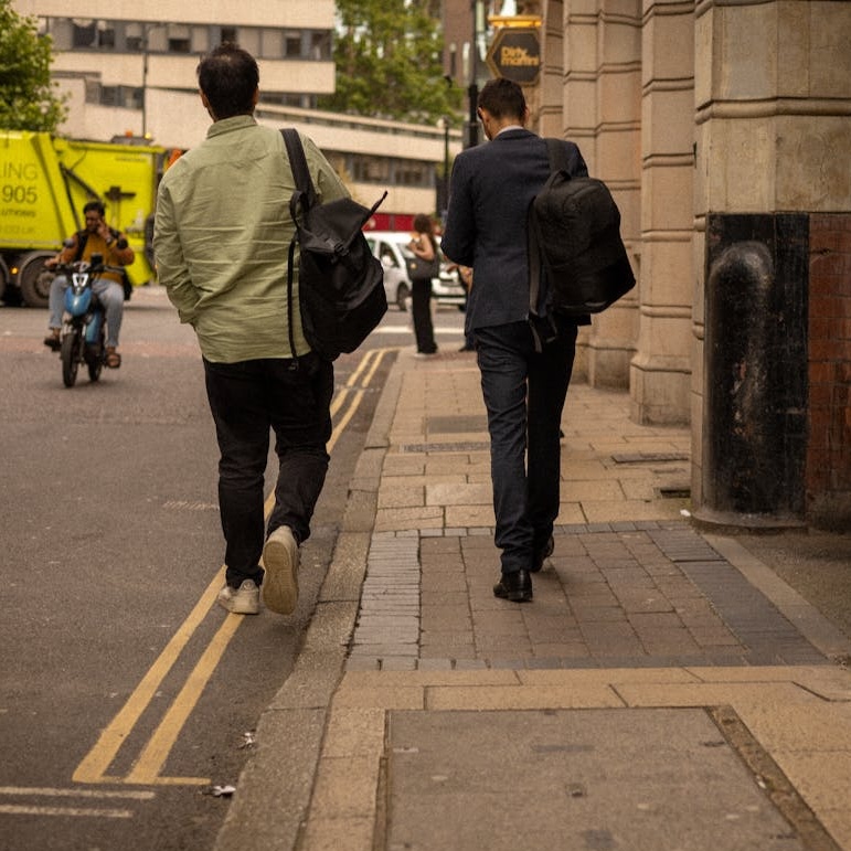 Businessmen walking down the street in Leeds